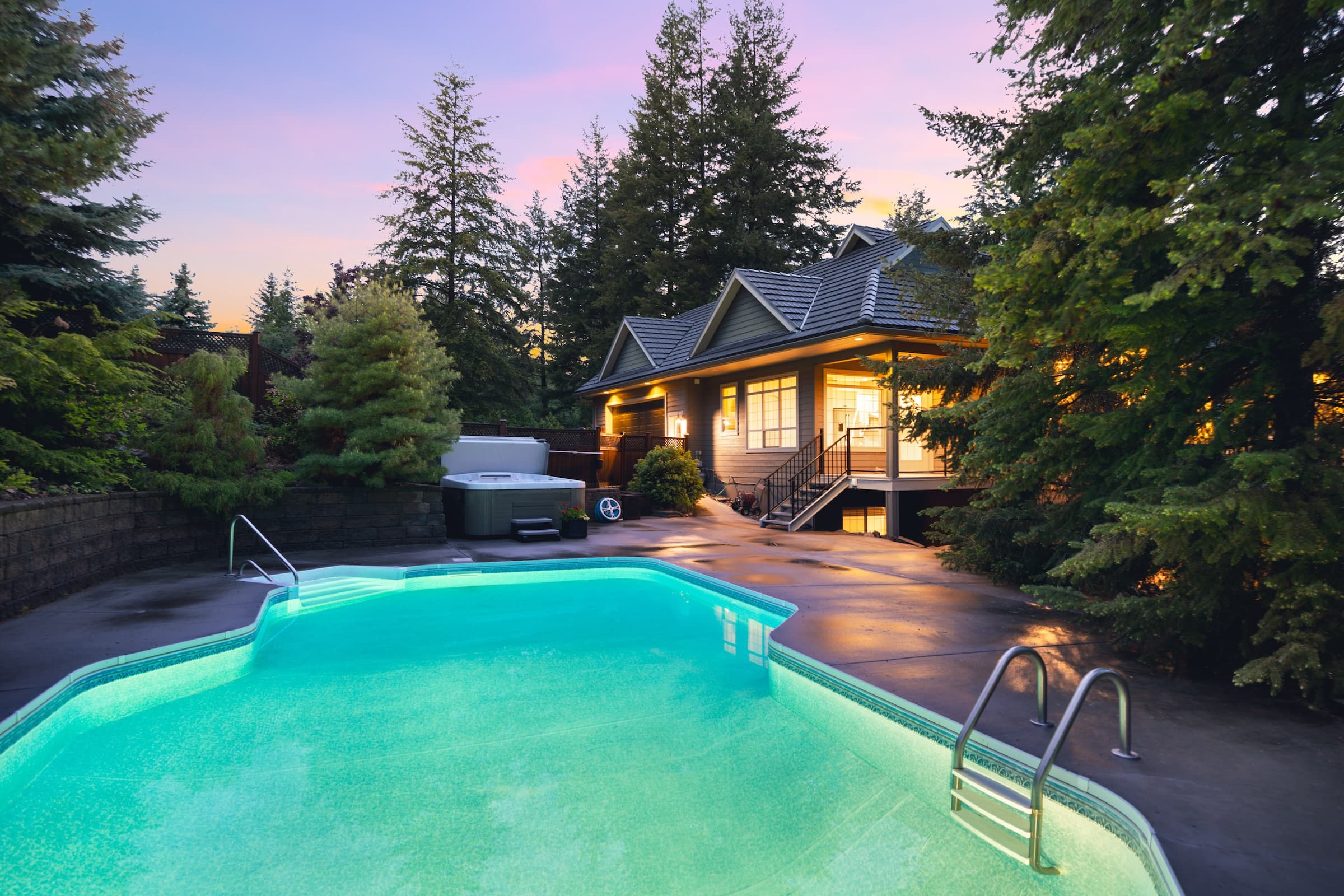 Aerial view of Coachwood Crescent home with pool at dusk