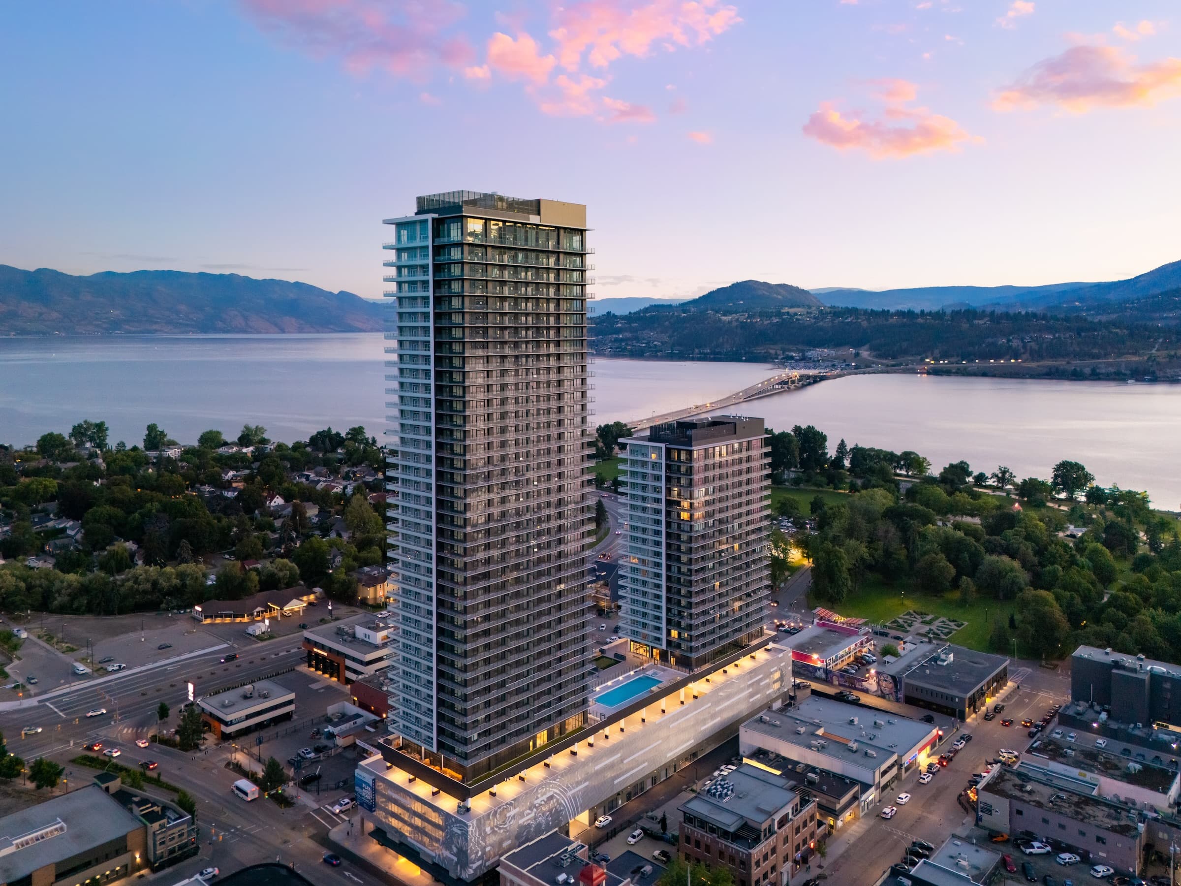 Waterstreet by the Park towers at sunset with Kelowna cityscape